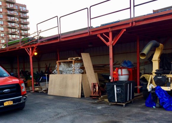 Proposal: Parade To Celebrate How Good RIOC Is At Spending Your Money Bric-a-brac, including Christmas decorations fill a shed with more on the roof.